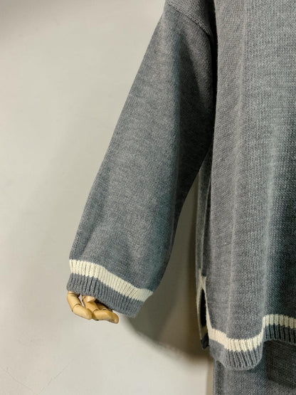 Nesthetics grey knit sweater and skirt set with white stripe details on cuffs and hem.