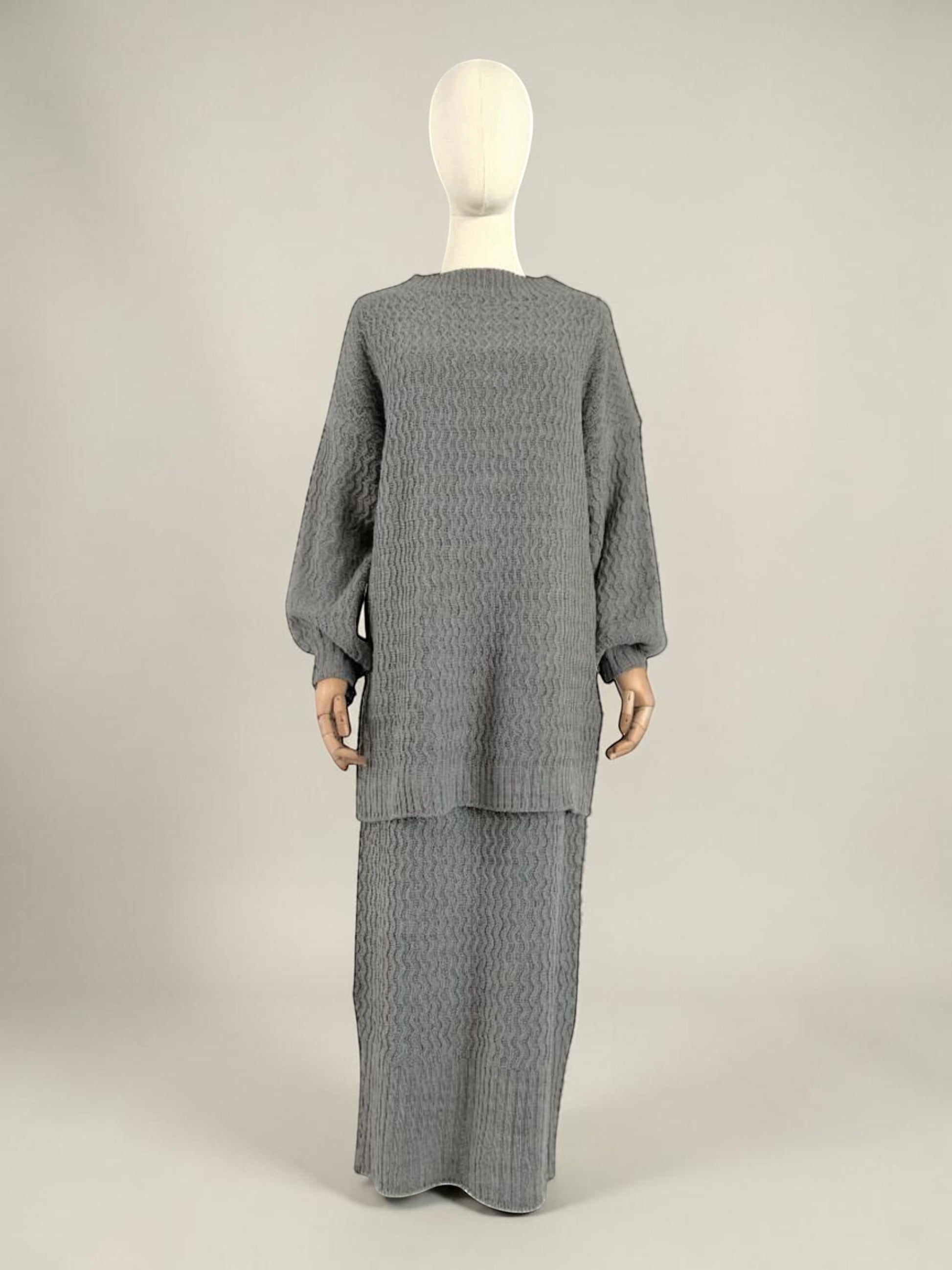 Nesthetics grey knit set with zigzag pattern, featuring balloon sleeves and a midi skirt. Mohair blend.