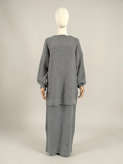 Nesthetics grey knit set with zigzag pattern, featuring a pullover with balloon sleeves and a matching long skirt. Mohair blend.