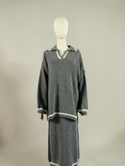 Nesthetics grey knit sweater with V-neck and white trim, paired with a matching midi skirt. Cozy winter set.