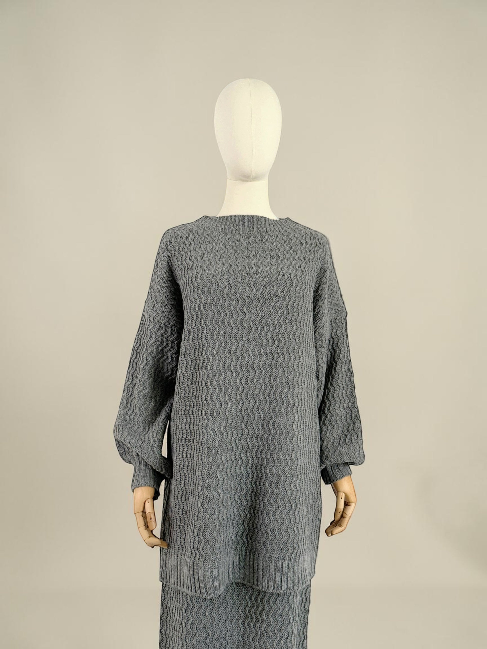 Nesthetics grey knit sweater with balloon sleeves and zigzag pattern, paired with a matching skirt. Mohair blend.
