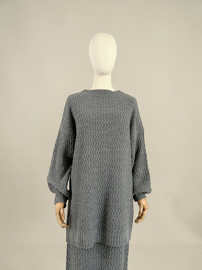 Nesthetics grey knit sweater with balloon sleeves and zigzag pattern, paired with a matching skirt. Mohair blend.
