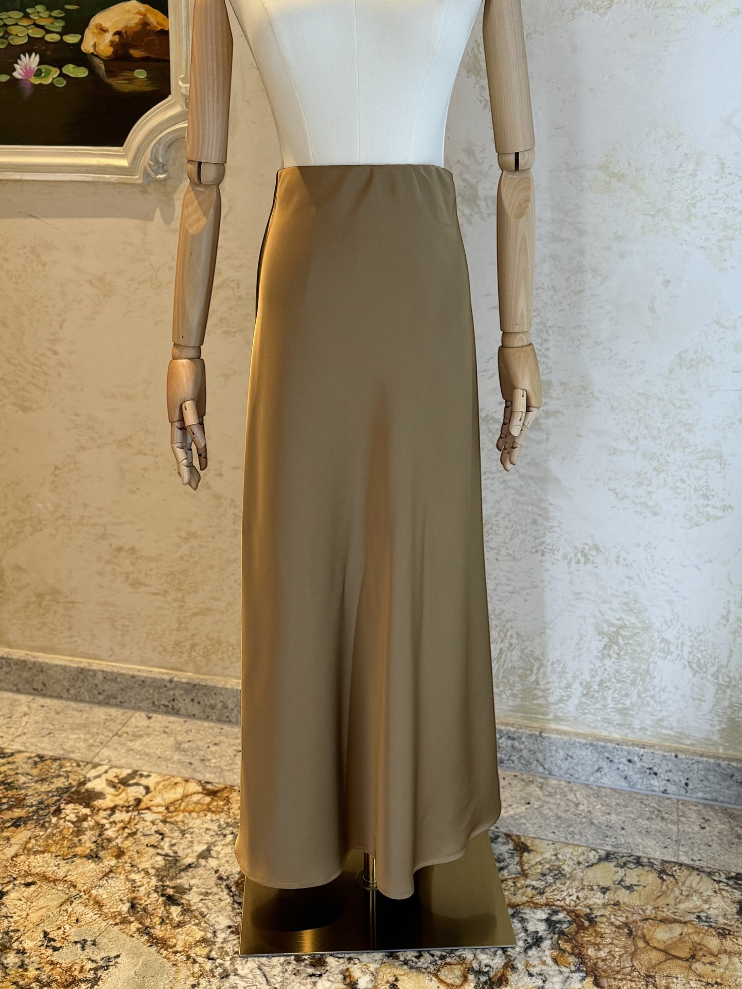 Nesthetics taupe satin maxi skirt with a flowing A-line silhouette. Elegant and luxurious, perfect for special occasions.